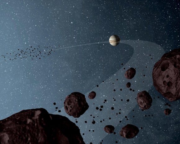 تصور فني لكوكب المشتري وبعض كويكبات طروادة بالقرب من الكوكب الغازي العملاق. الحقوق: NASA/JPL-Caltech